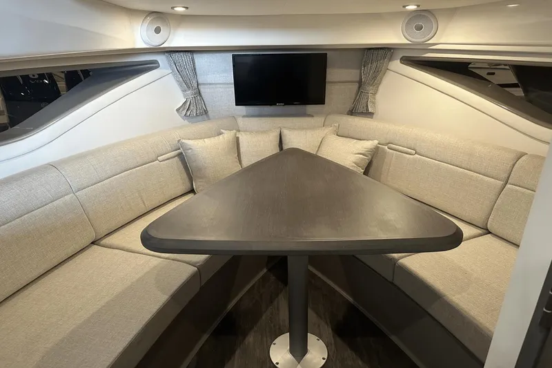 Slide: The Image of Luxurious interior of 2025 Sea Ray Sundancer 320 yacht with elegant seating and modern decor. - 22