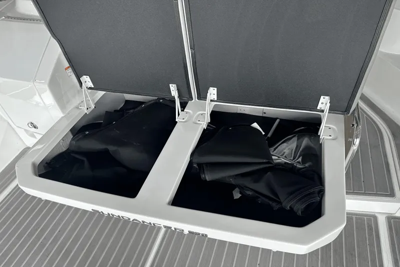 Slide: The Image of 2025 Sea Ray Sundancer 320 storage compartments open on deck. - 28
