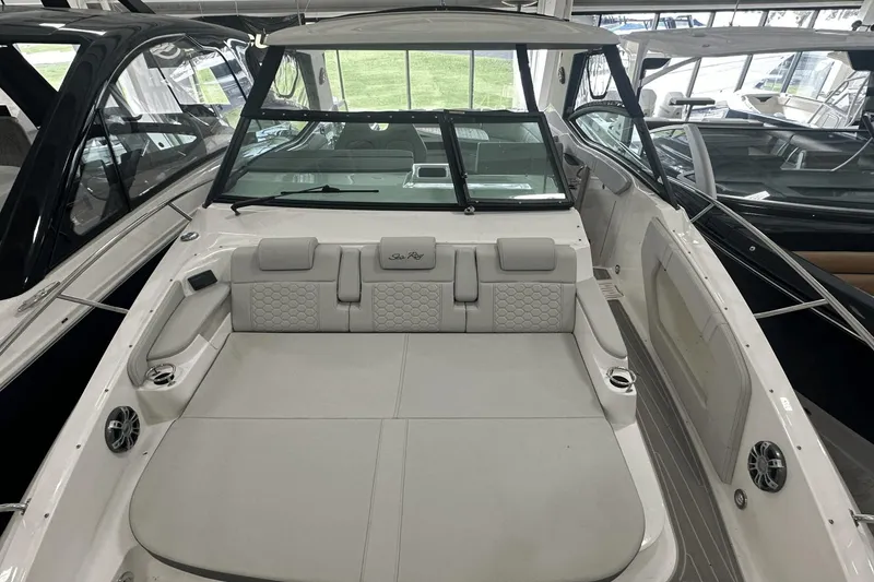 Slide: The Image of 2025 Sea Ray Sundancer 320 boat interior with spacious seating and modern design. - 5