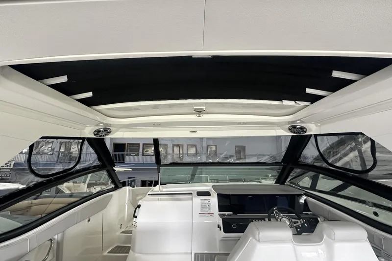 Slide: The Image of Interior view of 2025 Sea Ray Sundancer 320 yacht cockpit with modern design features. - 7