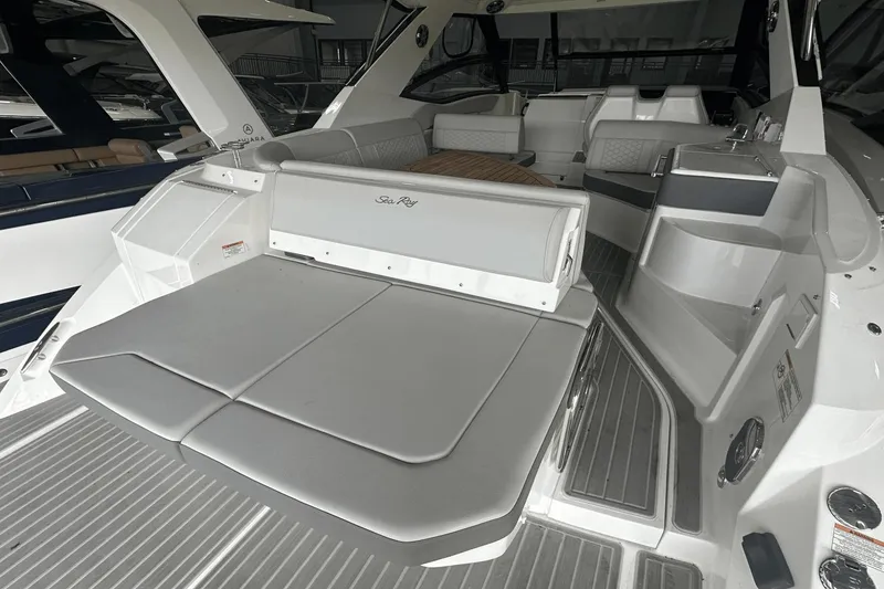 Slide: The Image of 2025 Sea Ray Sundancer 320 interior with sleek seating and modern design. - 9