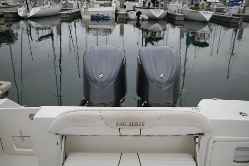 Slide: The Image of 2008 Everglades 270 Center Console with twin outboard motors docked at marina. - 14