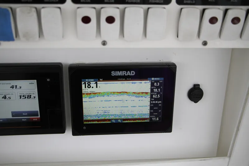 Slide: The Image of Simrad display on 2008 Everglades 270 Center Console boat dashboard. - 16