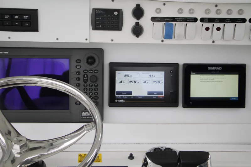Slide: The Image of Control panel of 2008 Everglades 270 Center Console with navigation and monitoring displays. - 20