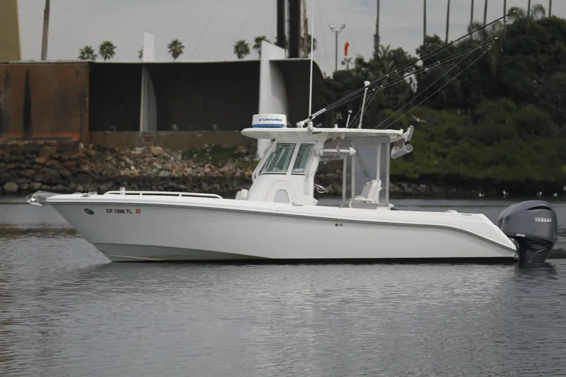 Slide: The Image of 2008 Everglades 270 Center Console boat on calm water, side view. - 6