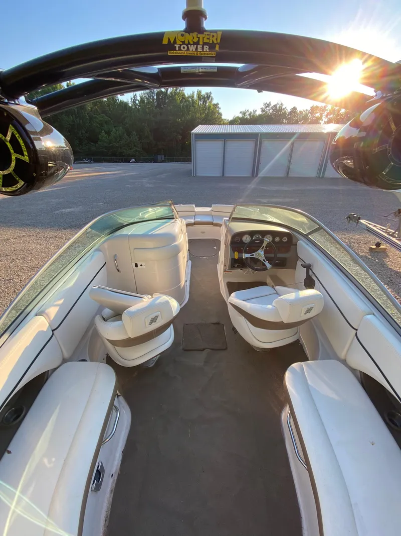 Slide: The Image of 2008 Four Winns F Series F244 boat interior with Monster Tower, white seating, and steering console. - 7