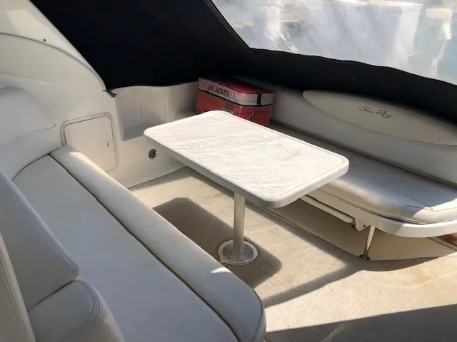 Slide: The Image of Interior of 2001 Sea Ray 340 Sundancer with seating and table. - 10