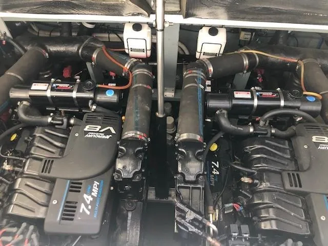 Slide: The Image of Twin engines of a 2001 Sea Ray 340 Sundancer boat. - 15