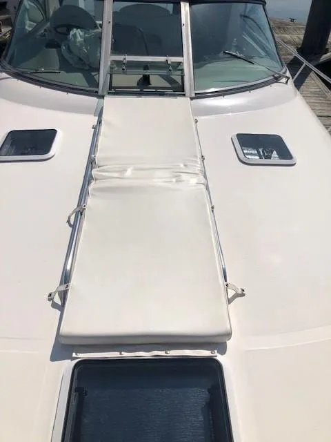 Slide: The Image of 2001 Sea Ray 340 Sundancer boat deck with sunpad and windshield. - 20