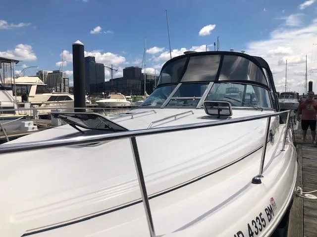Slide: The Image of 2001 Sea Ray 340 Sundancer docked at a marina on a sunny day. - 4
