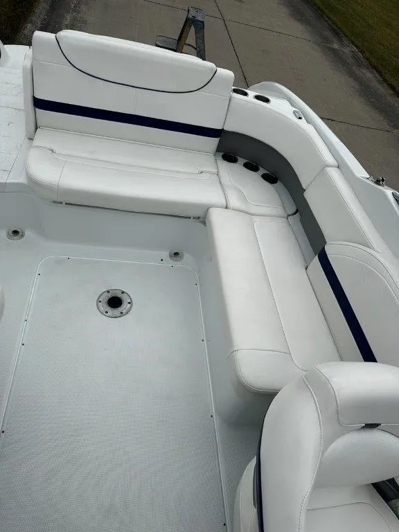 Slide: The Image of 2013 Formula 270 Bowrider boat with white and blue seating. - 12