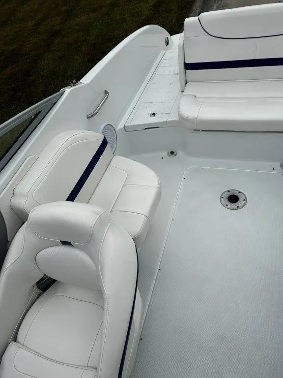 Slide: The Image of 2013 Formula 270 Bowrider interior with white seating and blue accents. - 13
