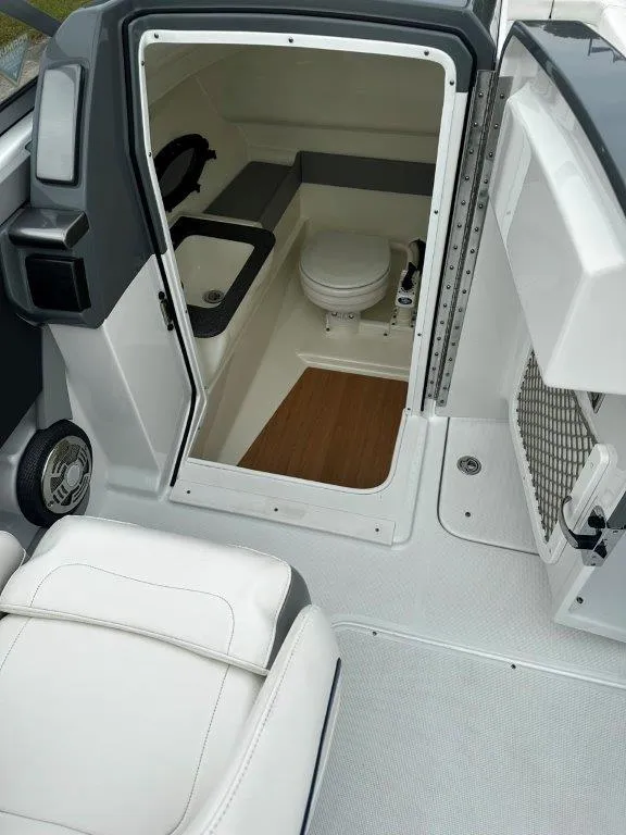 Slide: The Image of 2013 Formula 270 Bowrider boat interior with a compact bathroom. - 9