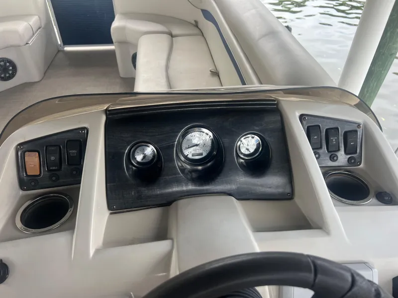 Slide: The Image of 2016 Bennington Sx boat dashboard with gauges and controls. - 14