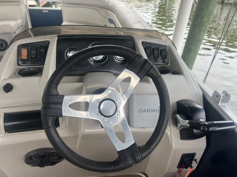 Slide: The Image of 2016 Bennington Sx boat steering wheel and dashboard with Garmin navigation system. - 15