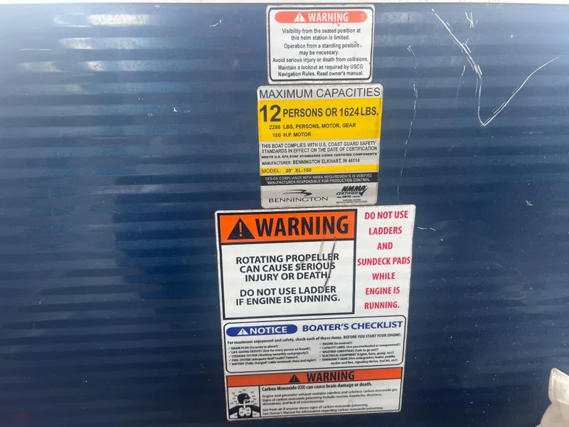 Slide: The Image of Warning labels on a 2016 Bennington Sx boat, including maximum capacities and safety instructions. - 26