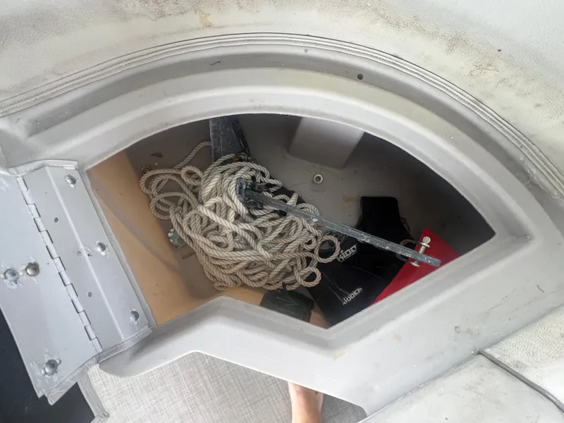Slide: The Image of Storage compartment of a 2016 Bennington Sx boat with anchor and rope. - 29