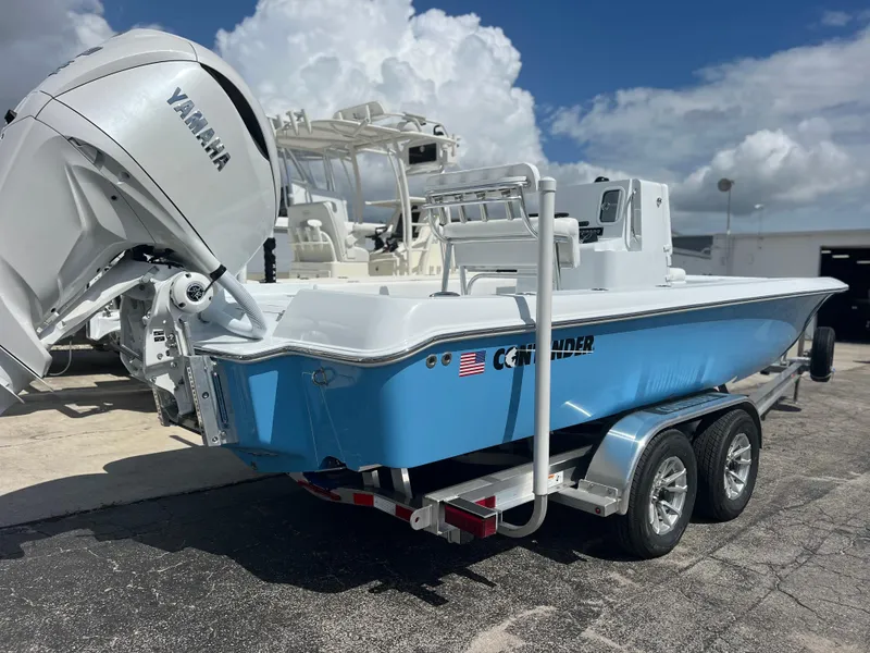 Slide: The Image of 2025 Contender 23 Bay boat with Yamaha engine on trailer. - 1