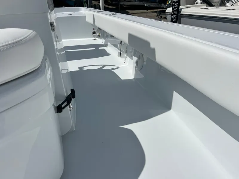 Slide: The Image of 2025 Contender 23 Bay boat interior, white seating and deck. - 11