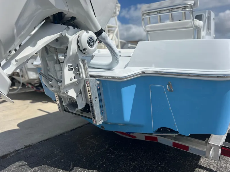 Slide: The Image of 2025 Contender 23 Bay boat rear view with motor and trailer. - 3