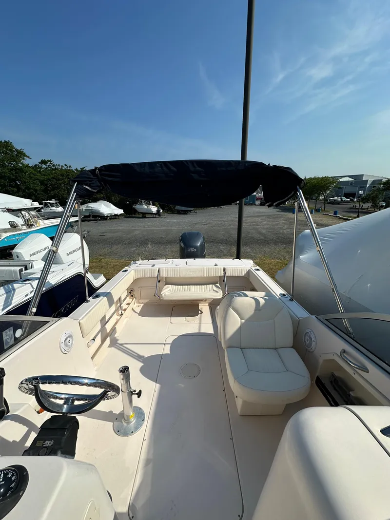 Slide: The Image of 2006 Grady-White 225 Tournament boat with seating and canopy. - 12