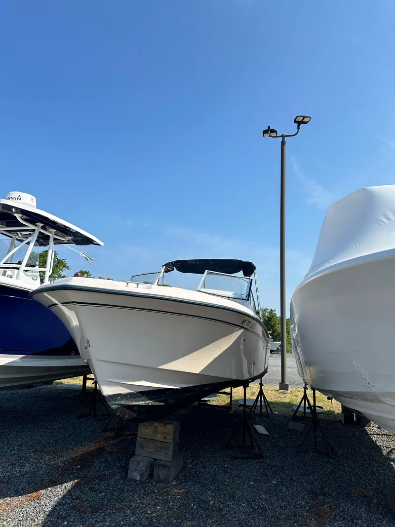 Slide: The Image of 2006 Grady-White 225 Tournament boat on stands under a clear blue sky. - 4