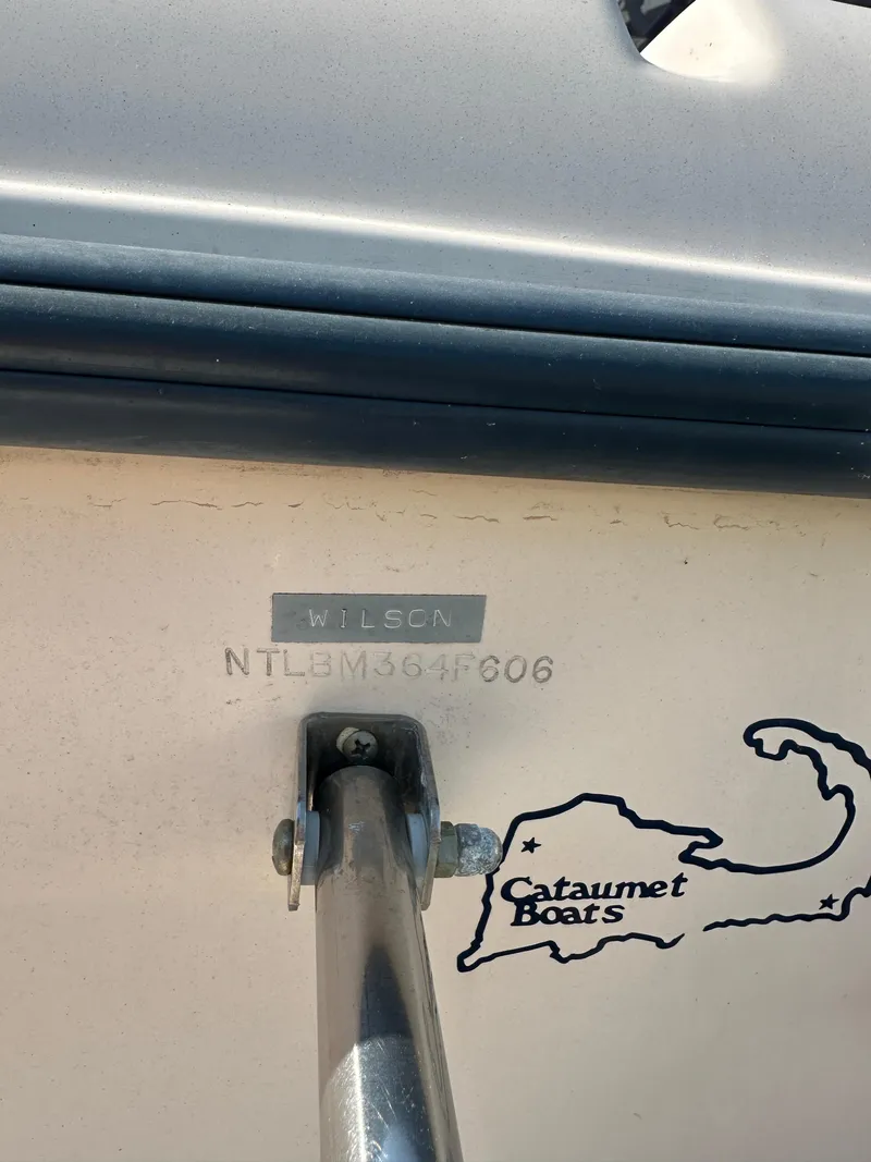 Slide: The Image of 2006 Grady-White 225 Tournament boat with serial number and Cataumet Boats logo. - 6