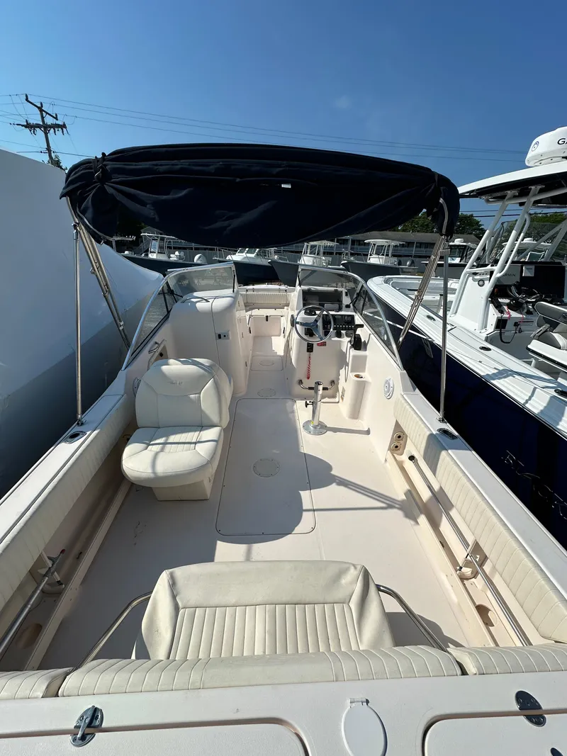 Slide: The Image of 2006 Grady-White 225 Tournament boat with seating and canopy. - 7