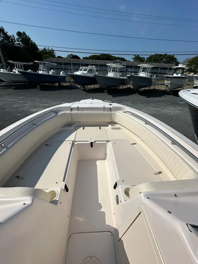 Slide: The Image of 2006 Grady-White 225 Tournament boat interior with seating and storage compartments. - 9