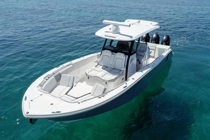 Slide: The Image of 2025 Sea Fox 368 Commander boat on clear blue water, showcasing sleek design and powerful engines. - 12
