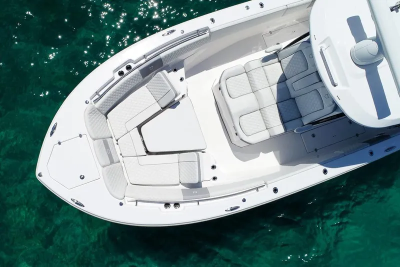 Slide: The Image of 2025 Sea Fox 368 Commander boat with luxurious seating on clear turquoise water. - 15