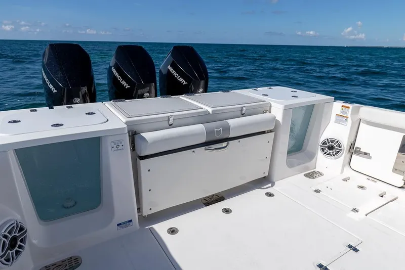 Slide: The Image of 2025 Sea Fox 368 Commander boat deck with triple Mercury engines on open sea. - 16