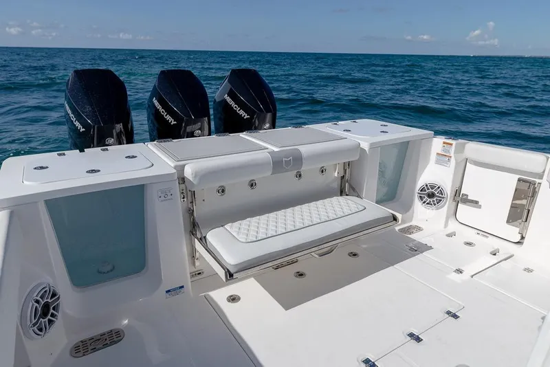 Slide: The Image of 2025 Sea Fox 368 Commander boat with triple Mercury engines on open ocean. - 17