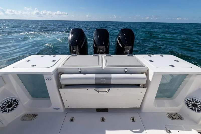 Slide: The Image of 2025 Sea Fox 368 Commander boat with triple Mercury engines on open ocean. - 19