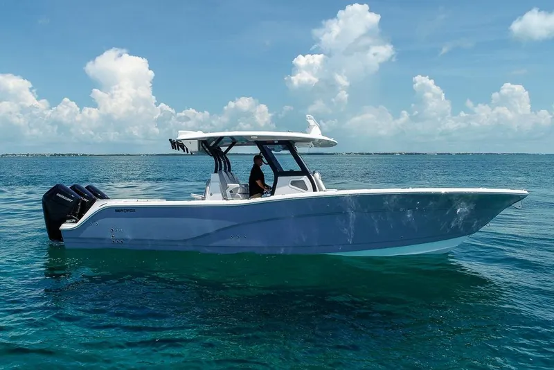 Slide: The Image of 2025 Sea Fox 368 Commander boat cruising on clear blue ocean waters. - 2