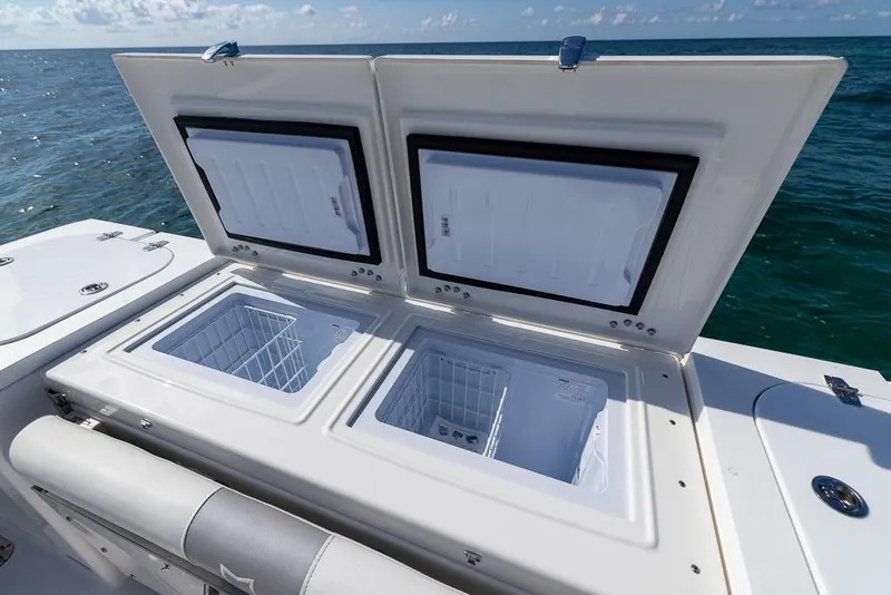 Slide: The Image of 2025 Sea Fox 368 Commander boat with open storage compartments on deck. - 20