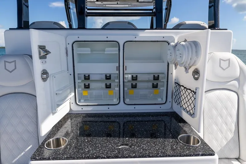 Slide: The Image of 2025 Sea Fox 368 Commander boat interior with open storage compartments and sleek design. - 22