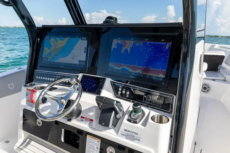 Slide: The Image of 2025 Sea Fox 368 Commander dashboard with advanced navigation displays and controls. - 24