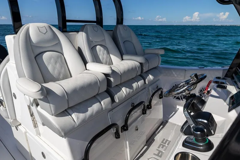 Slide: The Image of Luxurious seating on 2025 Sea Fox 368 Commander boat, ocean backdrop. - 27
