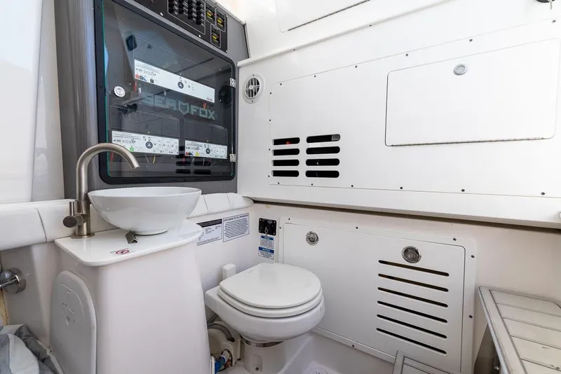 Slide: The Image of Interior of 2025 Sea Fox 368 Commander boat bathroom with sink and toilet. - 37