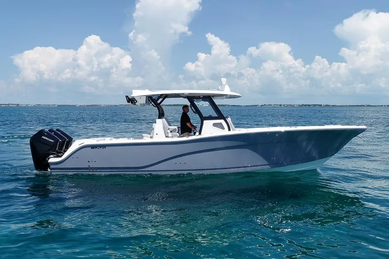 Slide: The Image of 2025 Sea Fox 368 Commander boat cruising on clear blue ocean waters. - 4