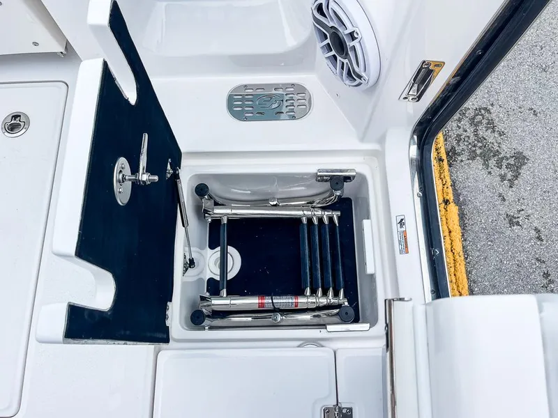 Slide: The Image of 2025 Sea Fox 368 Commander boat ladder compartment with speaker and hatch. - 41