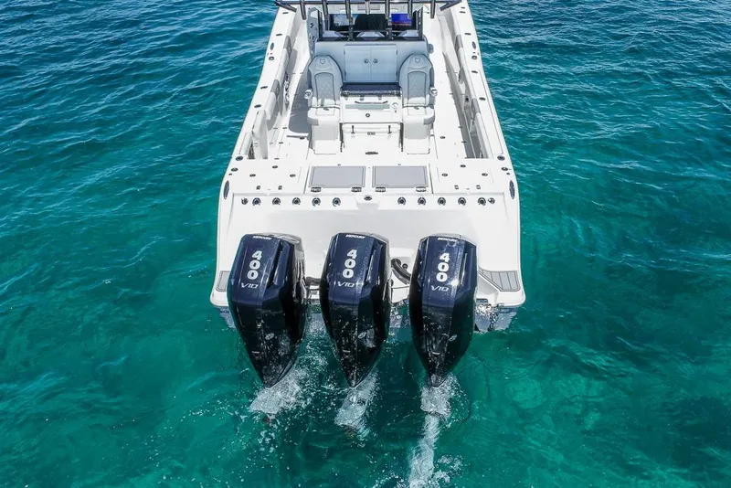 Slide: The Image of 2025 Sea Fox 368 Commander with triple 400 V10 engines on clear blue water. - 8