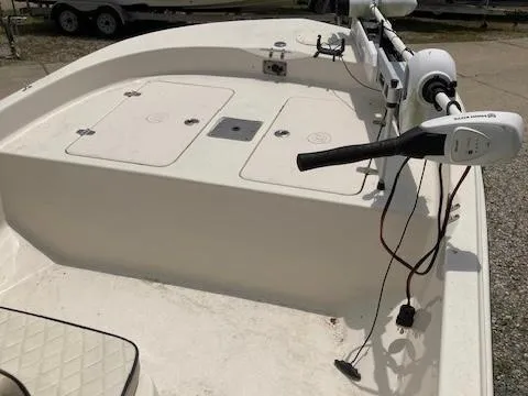 Slide: The Image of 2020 Carolina Skiff 19 JVS boat deck with trolling motor and storage compartments. - 8