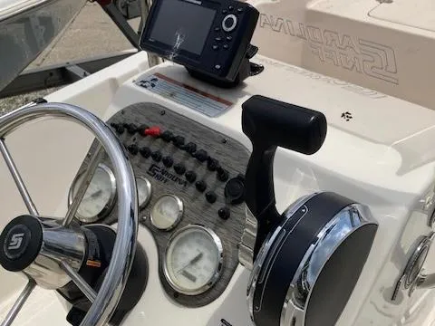 Slide: The Image of 2020 Carolina Skiff 19 JVS boat dashboard with steering wheel and controls. - 9