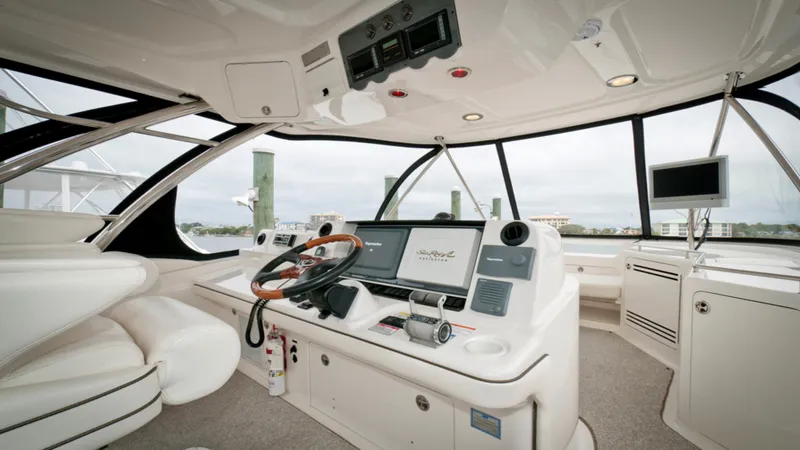Slide: The Image of Luxurious 2006 Sea Ray 58 Sedan Bridge yacht interior with modern navigation equipment. - 10