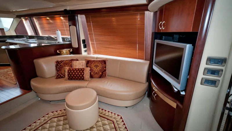 Slide: The Image of Luxurious interior of 2006 Sea Ray 58 Sedan Bridge yacht with leather seating and TV. - 3