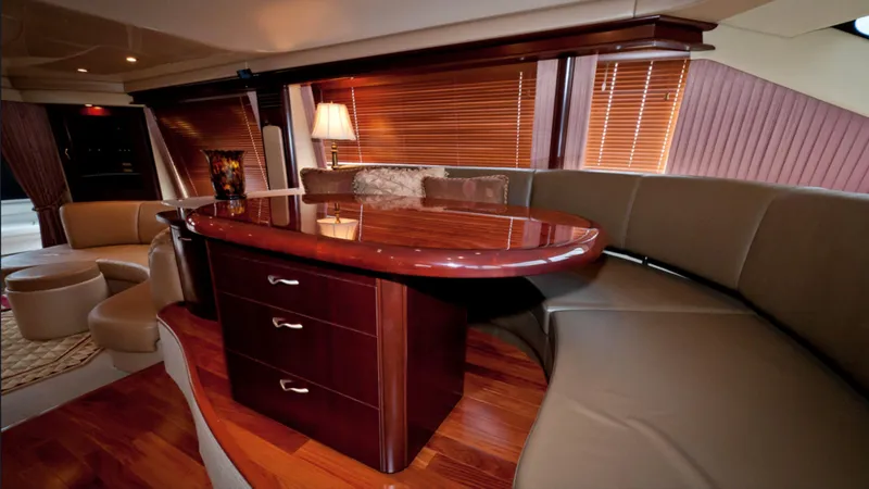 Slide: The Image of Luxurious interior of 2006 Sea Ray 58 Sedan Bridge yacht with elegant wood finishes. - 5
