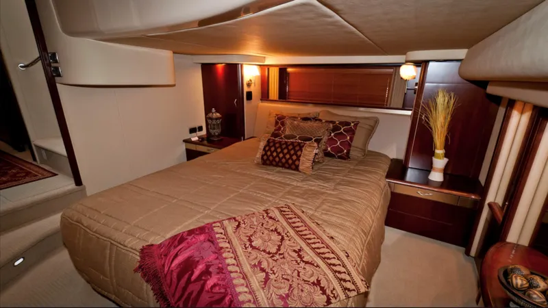 Slide: The Image of Luxurious bedroom interior of 2006 Sea Ray 58 Sedan Bridge yacht with elegant decor. - 6