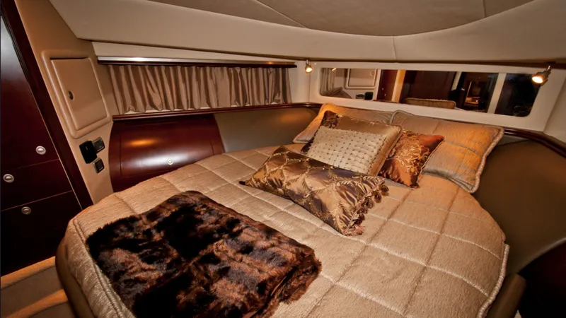 Slide: The Image of Luxurious bedroom interior of 2006 Sea Ray 58 Sedan Bridge yacht with elegant bedding. - 7